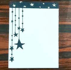 a piece of paper with stars hanging from it