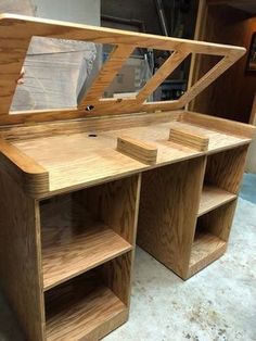 a wooden desk with shelves and drawers on it