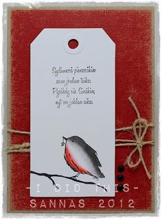 a red and white tag with a bird on it