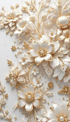 white and gold flowers on a white surface