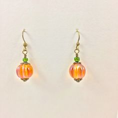 Handmade. Halloween, Fall Pumpkin Earrings!! Vintage Look Earrings. Art Glass Pumpkin Earrings With Czech Luster Glass, Orange Melon Beads. Hand Wire Wrapped. Cute Earrings For Halloween, Fun To Wear All Through The Fall, To Homecoming, Pumpkin Picking, Thanksgiving...Pretty Iridescent, Luster, Rainbow Aura Melon Beads Are The "Pumpkin". Olive Green Metallic Seed Beads Are The "Stem". What A Great Hostess Gift! Brand; Hand Crafted. Material; Czech Luster Glass Orange Melon Beads, & Olive Green G Art Glass Pumpkin, Pumpkin Bead, Glass Bangles, Rainbow Aura, Pumpkin Picking, Earrings Art, Crystal Bead Necklace, Pumpkin Earrings, Beaded Drop Earrings