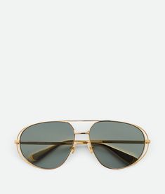 Find BOTTEGA VENETA Classic Aviator Sunglasses on Editorialist. Lenses made from polyamide with 39% bio-based content. BV1344S 001. Color: Gold/Green. Metal. Gold Aviator Sunglasses, Green Shop, Jewelry Knots, Green Metal, Leather Denim, Green Material, Eyewear Fashion, Boots And Sneakers, Flat Boots