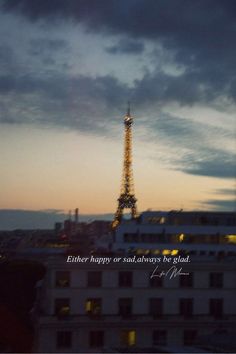 the eiffel tower lit up at night with a bible verse written below it