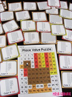 the place value puzzle is on display with numbers and colors in it's center