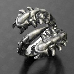 a silver ring with spikes on it sitting on a table