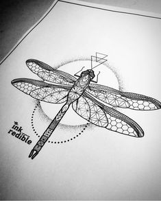 a black and white drawing of a dragonfly on top of a piece of paper