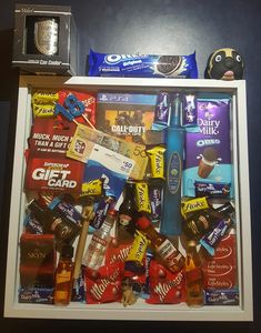 an assortment of snacks and candy in a box