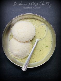 two scoops of mashed potatoes in a bowl with broth