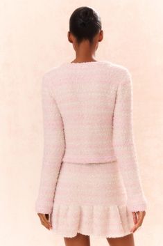 Pretty in pink in the Blanca Cardigan. This polished layer features a sequin yarn mixed with a boucle yarn creating a stunning, dynamic dimensional texture. This slim-body sweater has four patch pockets with buttons on each and embellished buttons down center front with pearls and crystals dotted on a gold setting. Pair with the Velman Skirt for a full set. Embellished Buttons, Four Patch, Knit Mini Skirt, Hemant And Nandita, Boucle Yarn, Fall Mini, Exclusive Clothing, Floral Outfit, Midi Maxi Dress