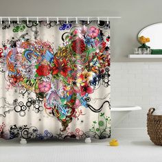 the shower curtain is decorated with colorful flowers and swirls on white tile flooring