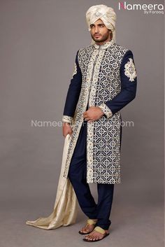 Elegant Sherwani for Men in Navy Blue color 2021 in Stylish design embellished with hand machine. This Sherwani is looking so beautiful and best choice for groom for wedding event. Sherwani: Classy Sherwani in navy blue color with heavily embroidered with machine, dabka, thread embroidery along with hand touching. Sherwani for men Wedding fabric is jamawar. Turban: Elegant Sherwani for Men is paired with beautiful Cream Color Traditional Turban embellished with stone. Pajama: Sherwani for Men is Barat Dresses, Sherwani Wedding, Navy Blue Pajamas, Blue Sherwani, Dresses Dinner, Sherwani For Men Wedding, Mens Dress Outfits, Mens Sherwani, Dress Pictures