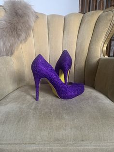 Royal purple covers the entire top portion of the heels while the underside is covered in an ultra fine yellow glitter. These heels can be made in any color combo desired. If you would like another color combination please leave your color choices at checkout otherwise your pair will be created in the colors shown. Prom Yellow, Yellow High Heels, Heels Purple, Womens Costume, Glitter High Heels, Yellow Heels, Yellow Glitter, Costume Shoes, Purple Shoes