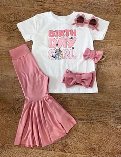 Our Bluey Birthday outfit is so cute. This top will match most of our bell bottoms. This outfit is perfect for a shower girt or any birthday. We can't wait to see what combo you purchase. Don't forget we have a matching Mama and Daddy top too! just to make this birthday even more special.  Too is 100% cotton Content: 96% Polyester & 4% Spandex Care: Machine Wash, Cold; Tumble Dry, Low; Use Cool Iron. This item is not our own design. We can not change or alter in anyway. | Please do not leave chi Bluey Birthday Party Outfit, Fitted Sets For Birthday And Summer, Fitted Sets For Birthday In Summer, Fitted Sets For Summer Birthday, Fun Cotton Sets For Birthday, Fun Birthday Sets For Spring, Pink Birthday Set For Spring, Short Sleeve Clothing Sets For First Birthday In Spring, Pink Spring Birthday Set