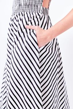 A perfect example of playful meets pretty, our Striped Smocked Dress is perfect for any summertime activity. The fun and flirty striped print is accented by an elastic detailed back and smocked bodice. The midi length provides just the right amount of coverage, while the fully lined skirt ensures utmost comfort. No matter where your day takes you, this dress will have you looking and feeling your best. Striped print Elastic detailed back Smocked bodice Midi length Fully lined Hand wash cold Do not bleach Do not tumble dry Iron low Shell: 100% Cotton Lining: 80% Polyester 20% Cotton TL768D Total length:46" Bust:31" S Height 5'8"(173cm) / Bust 32"(81cm) / Waist 25"(67cm) / Hip 35"(89cm) English Factory, Lined Skirt, Smocked Dress, Black Xs, Stripe Print, Midi Length, Bodice, White Black, White And Black