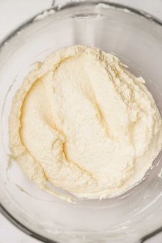 a bowl filled with white powder on top of a table