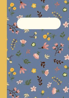 a blue notebook with flowers and leaves on it