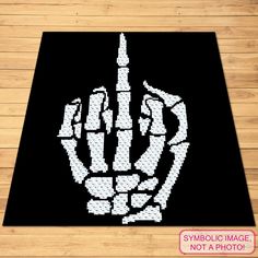 a black area rug with white dots on it and a hand that is made out of legos