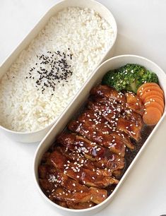 two containers filled with rice, broccoli and chicken on top of each other