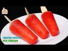 watermelon ice cream popsicles on a white plate