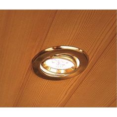 a light that is on the side of a wooden wall with wood grained walls