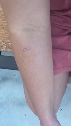 a person with small tattoos on their legs