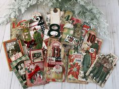 a pile of christmas cards sitting on top of a wooden floor