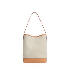 Mansur Gavriel everyday hobo bag in linen and cotton  Shoulder strap, 11" drop Open top with magnetic closure  Approx. 13.4"H x 10.4"W x 6.7"D Made in Italy Canvas Double Handle Shoulder Bag For Errands, Canvas Shoulder Bag With Double Handle For Errands, Canvas Bucket Shoulder Bag, Beige Canvas Hobo Bag, Canvas Tote Shoulder Bag For Errands, Everyday Bucket Bag With Canvas Lining, Everyday Beige Hobo Bag With Leather Handles, Neutral Hobo Shoulder Bag With Adjustable Strap, Canvas Hobo Shoulder Bag For Shopping