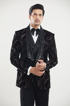 Black tuxedo featuring thread, sequin embroidery in abstract pattern. Paired with a waistcoat, white shirt, black pant and a bow. - Aza Fashions Fitted Party Wear Blazer For Festive Occasions, Embroidered Fitted Nehru Jacket For Party, Fitted Black Outerwear For Eid, Fitted Long Sleeve Bandhgala For Celebration, Festive Black Blazer, Festive Black Fitted Nehru Jacket, Festive Party Blazer With Resham Embroidery, Waistcoat Pattern, Shawl Collar Tuxedo