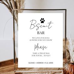 a sign that says, biscuit bar we love our dogs and where sure you know it please take a treat bag for your guests to go