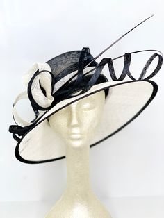 This beautiful sinamay piece is round in shape, adorned with sinamay loop decor and two ostrich quill's. Find the perfect fit with the hat's internal elastic band which allows a maximum crown allowance of 22.5". Church Suits And Hats, Hat Tea Party, Derby Fashion, Plaid Bow Tie, Black Church, Church Hat, Navy Hats, Tea Party Hats, Elegant Hats