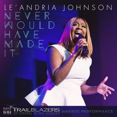 a woman singing into a microphone with the words let's andria johnson never would have made it