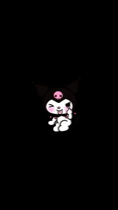 a black and white cat with pink eyes on it's face in the dark