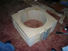 an unfinished cardboard box sitting on the floor