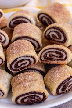 a plate filled with pastries on top of a table