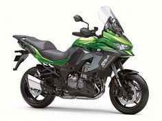 a green and black motorcycle on a white background