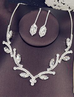 a necklace and earring set with crystal stones