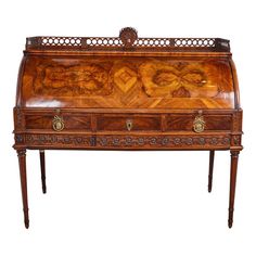 an old wooden desk with ornate carvings on it