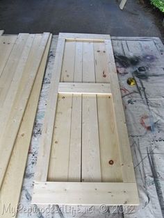 several pieces of wood sitting on top of a wooden floor next to some construction materials