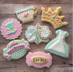 decorated cookies are arranged in the shape of princess dresses and tiaras, with words that say happy birthday