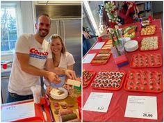 a man and woman standing in front of a table filled with food