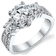 Make your ring finger shine with elegance with this high-polish finish Sterling Silver 925 three-stone engagement ring. This traditional luminous ring has a 1.50 carat AAA grade round-cut Cubic-Zirconia stone hugged by two .35 Carat stones, a symbol of "Past, Present, Future". Sterling Silver wedding engagement ring. Stamped 925 to assure proper concentration of 92.5% solid sterling silver. Large 1.50 Carats Cubic-Zirconia center stone and two 0.35 side stones. Stone will keep their shine and cl Cubic Zirconia Wedding Rings, Cheap Engagement Rings, Cubic Zirconia Engagement Rings, Wedding Engagement Ring, Past Present Future, Engagement Ring Sizes, Three Stone Engagement, Three Stone Engagement Rings, Stone Engagement