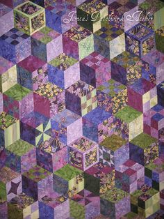 a very colorful quilt with many different colors