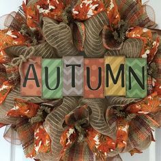 a wreath with the word autumn written on it