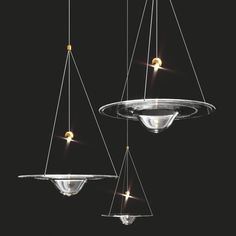 three suspended lights in the shape of scales