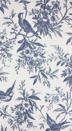 a blue and white floral wallpaper with birds on it