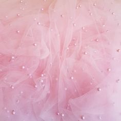 pink and white tulle with pearls on it