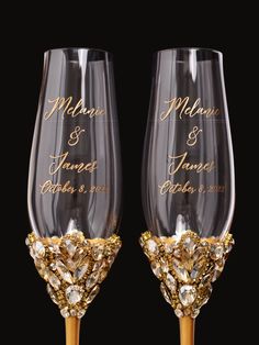 two wine glasses with gold glitter on them