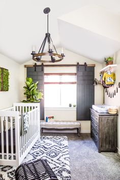 a baby's room with black and white decor