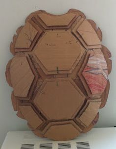 a wooden object sitting on top of a white shelf