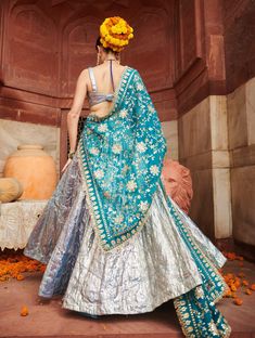 A breathtaking creation, this full powder blue lampi lehenga is paired with a matching square neck blouse that enhances your elegance. The look is beautifully highlighted by an organza dupatta adorned with fine kiran detailing, adding a touch of sophistication and grace. Perfect for festive celebrations, this ensemble effortlessly combines charm and style. Square Neck Blouse, Beach Wedding Guests, Ritu Kumar, Jacket Cape, Organza Dupatta, Indian Ethnic Wear, Kaftan Dress, Designer Wear, Powder Blue